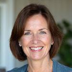 Portrait of Dr. Evelyn Reed, a Certified Mindfulness Expert, smiling warmly.